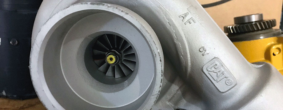 Caterpillar 3306 Turbocharger Caterpillar 3306 Turbocharger in front of a Cat waterpump and TDI starter for a Cat 3306